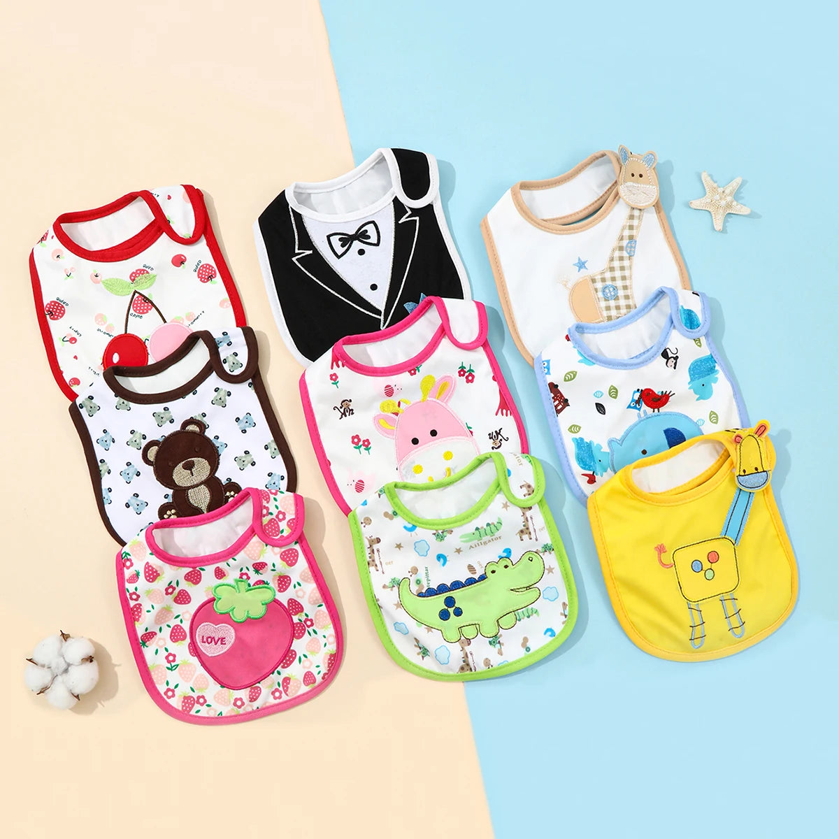 A set of colorful waterproof baby bibs and burp cloths featuring various cartoon prints on a light blue background.