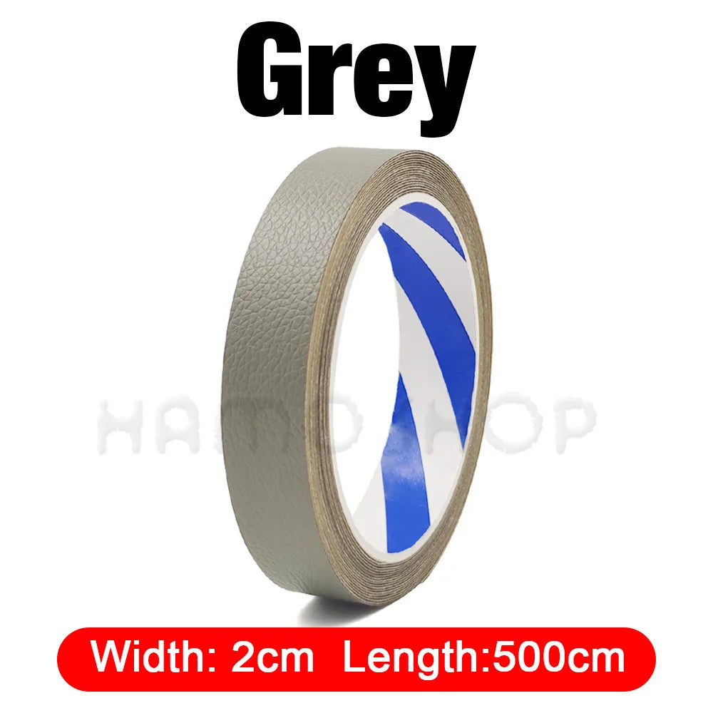 Grey self-adhesive PU leather repair patch roll with blue stripes, measuring 2cm wide by 500cm long.