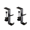 A pair of black foldable aluminum desk hooks designed for hanging bags and coats.