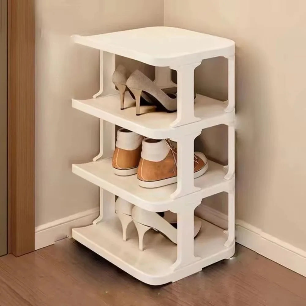 A white stackable vertical shoe rack with four tiers for storing and organizing shoes.