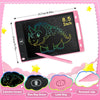 A pink LCD writing tablet for kids featuring a dinosaur design and accessories like a pencil, eraser, and lock key.