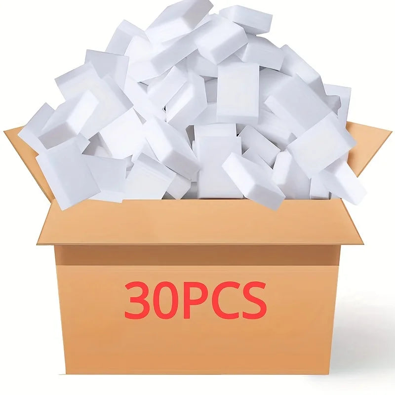 A box filled with white, cube-shaped multi-purpose magic cleaning sponges.