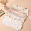 A stack of six layers of soft absorbent baby burp cloths in various pastel colors and patterns is displayed on a light backgr