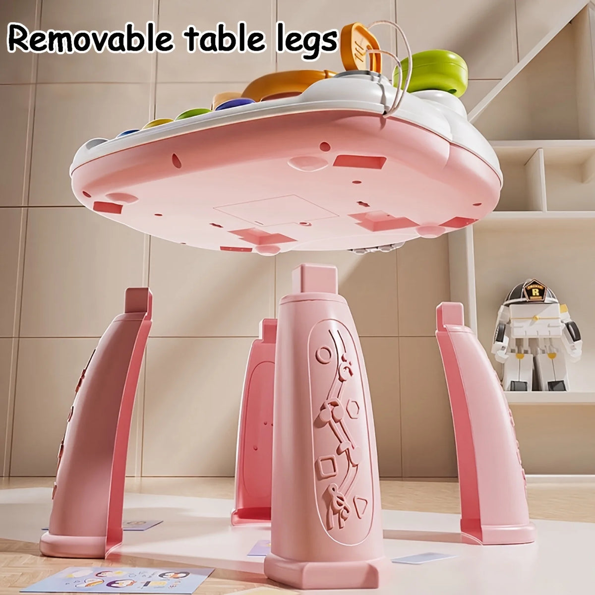 Pink removable table legs for a baby interactive activity table with piano and steering wheel