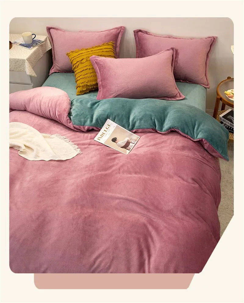 A pink flannel duvet cover with a zipper, layered with various colored pillows and a teal blanket on a bed.