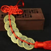 Chinese Feng Shui wealth coins strung together with a red handmade knot