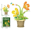 A set of creative flower pot building blocks featuring roses, sunflowers, and carnations in various colors.