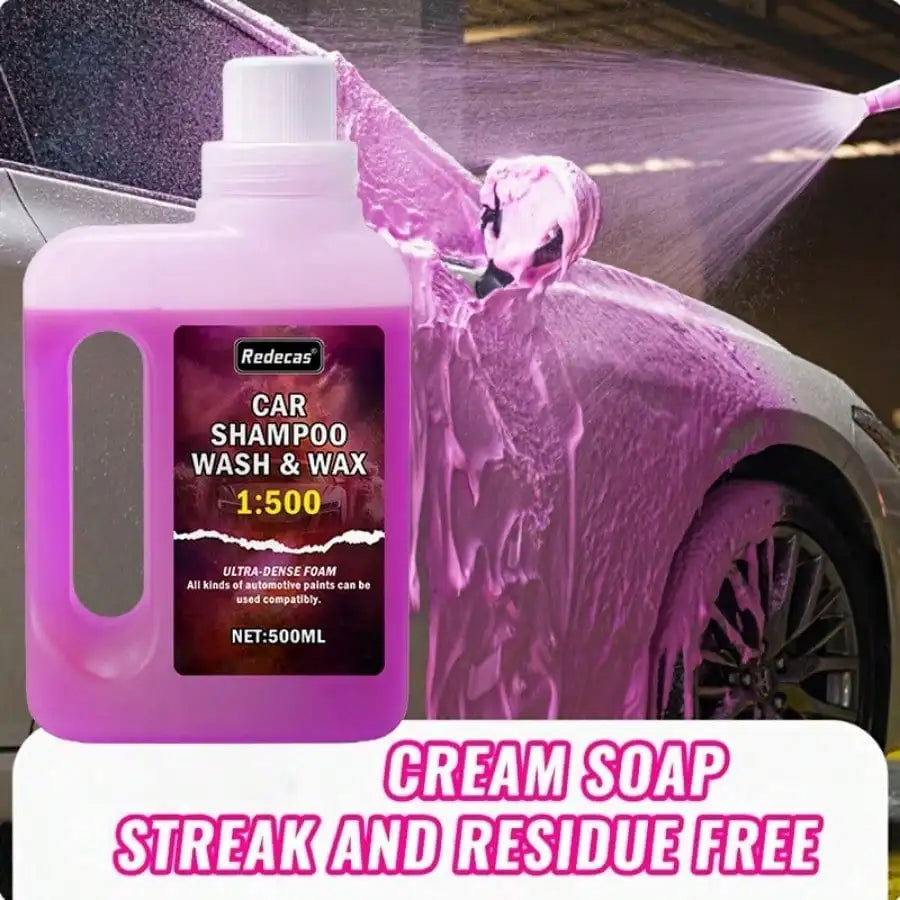 A pink bottle of Redecas car shampoo wash and wax is shown spraying foam onto a car surface.