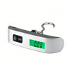 A silver portable digital luggage scale with an LCD display showing 0.00 lb.