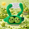 Handmade crochet pocket hug doll shaped like a green caterpillar with a positive message tag.