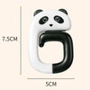 A white and black panda-themed portable bag hook with a curved design shown against a measurement scale.