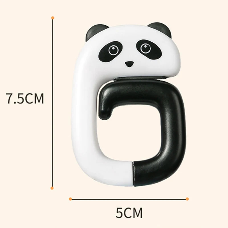 A white and black panda-themed portable bag hook with a curved design shown against a measurement scale.