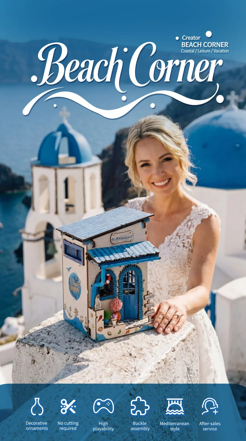 A woman holds a small wooden beach corner DIY book nook kit with blue accents and LED lighting on a stone surface.