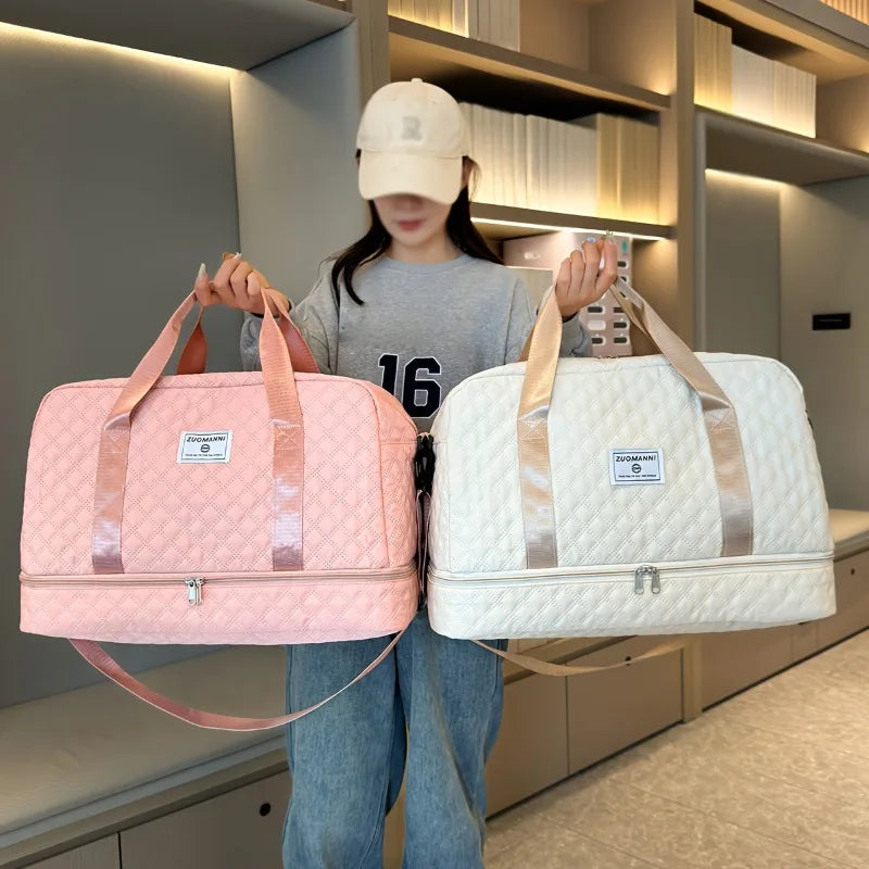 A woman holds two light pink and white nylon travel duffle bags in a modern store setting.