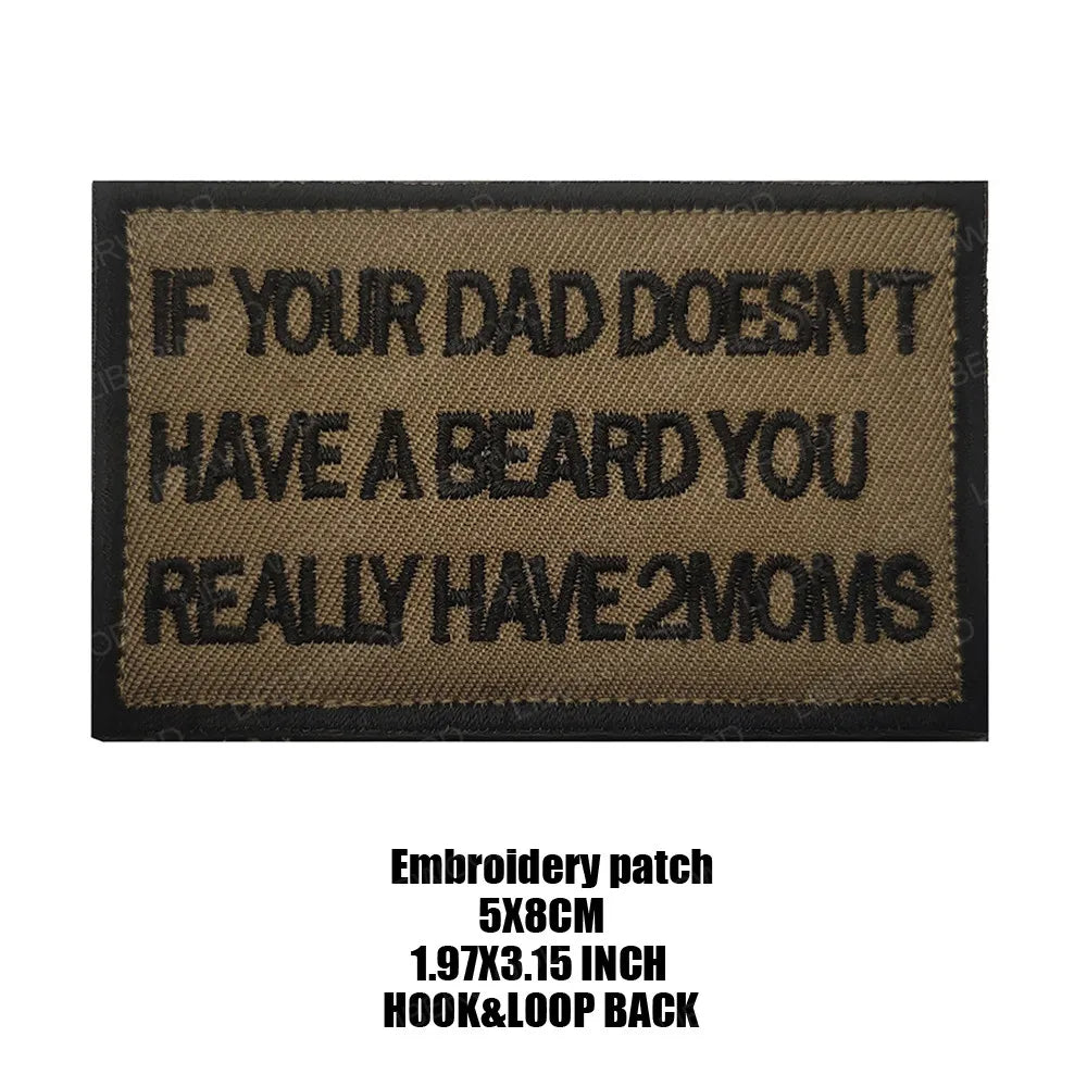 A black embroidered patch with white text that reads If your dad doesn't have a beard you really have 2 moms