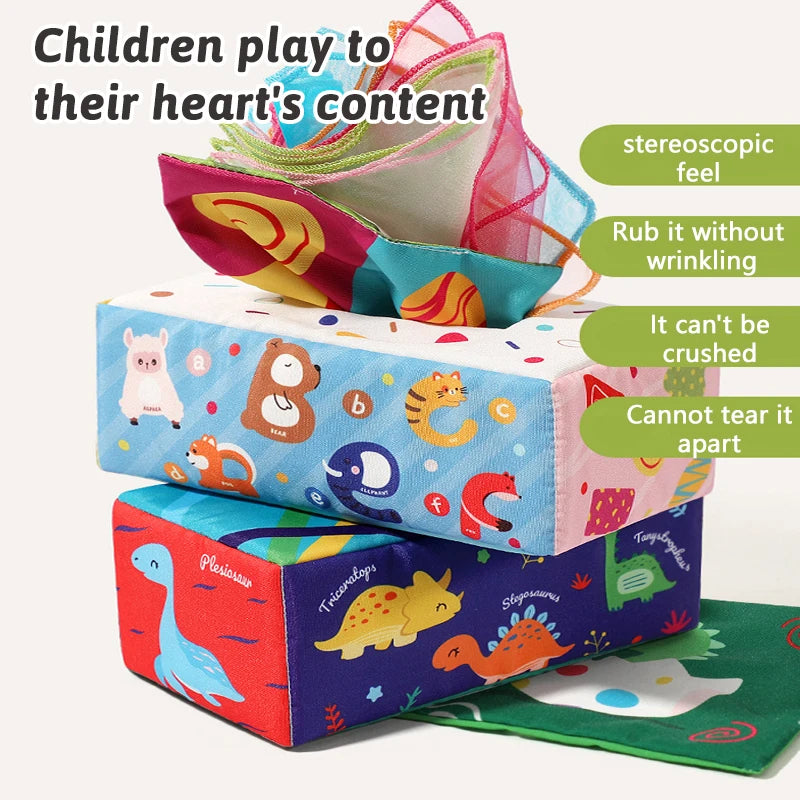 A colorful sensory tissue box toy featuring crinkle scarves and various shapes for children to play with.