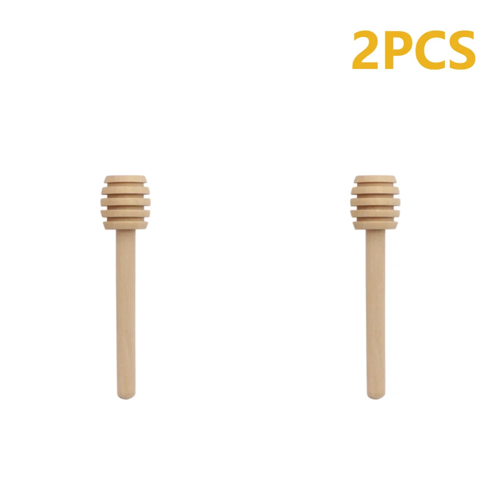 Two natural wood honey dipper sticks shown side by side.
