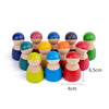 A set of colorful wooden rainbow stacking blocks in various colors and sizes.