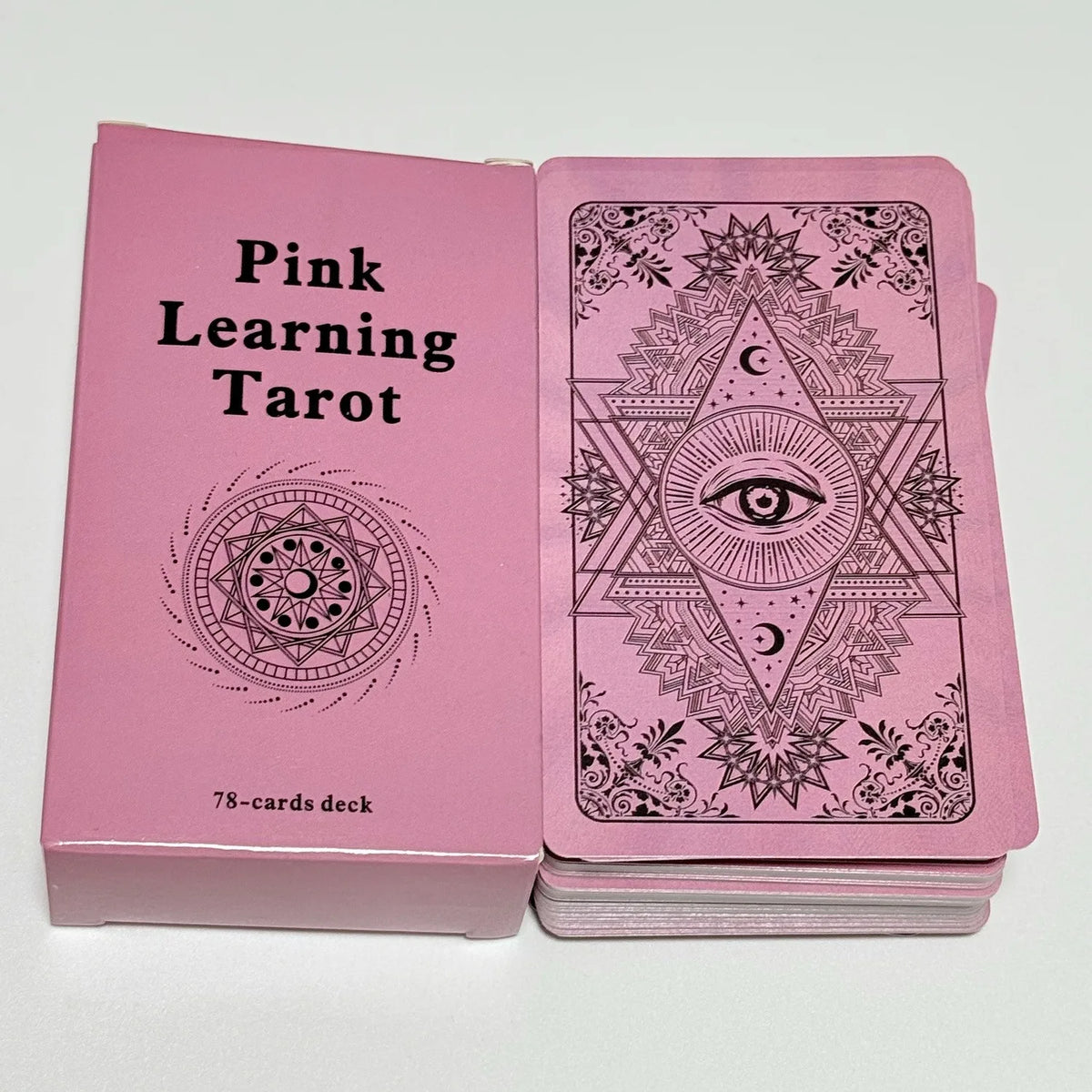 A pink box containing a 78-card deck of Pink Learning Tarot cards with intricate designs.