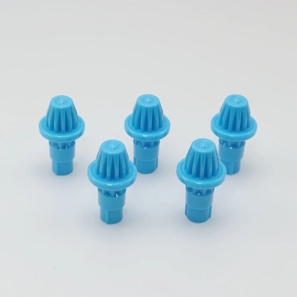 A set of five blue plastic replacement drivers for a battling top, packaged together.
