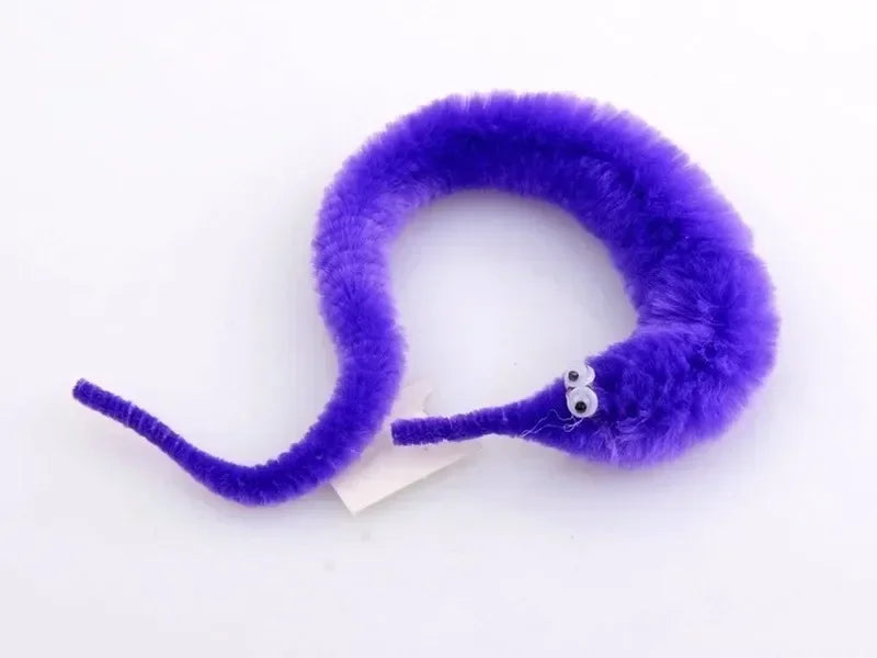 A purple fuzzy caterpillar trick with a small silver eye detail.