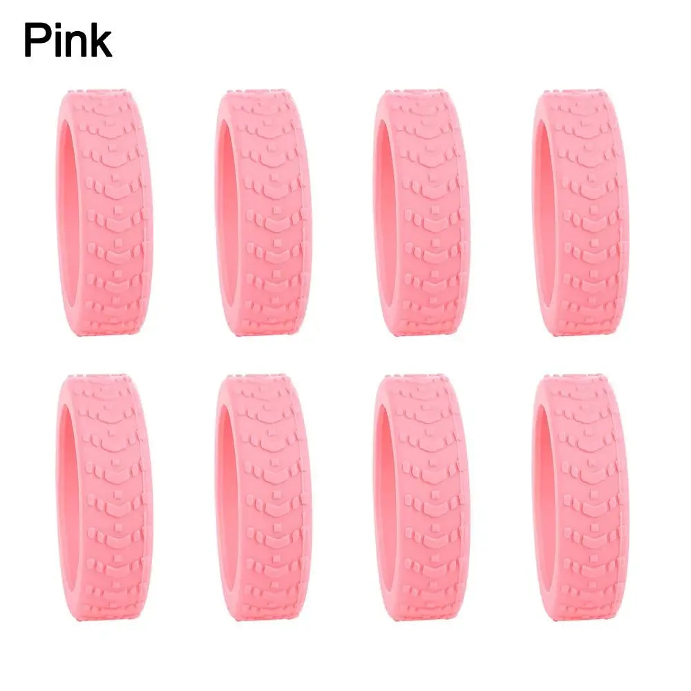 A set of pink silicone luggage wheel protectors designed to prevent scratching and reduce noise during travel.