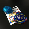 A blue metal battle spinning top is shown next to a white card with colored markings.