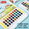 A white watercolor paint set featuring a palette of 36 colors and water brush pens is displayed on a light blue surface.