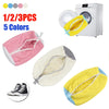 Five colored breathable shoe washing bags, including pink, white, yellow, and blue, shown next to a washing machine.