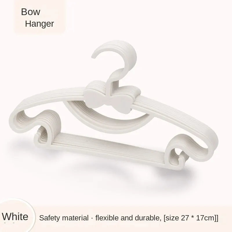 White Bow Hanger for baby clothes, flexible and durable.