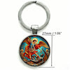 Silver key chain featuring an oval pendant depicting the Saint Michael Archangel.