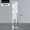 A clear, transparent mist spray bottle with a white pump dispenser and a long neck, shown against a gray background.
