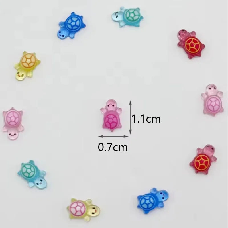 A collection of glow-in-the-dark mini turtle figurines in various colors and shapes.