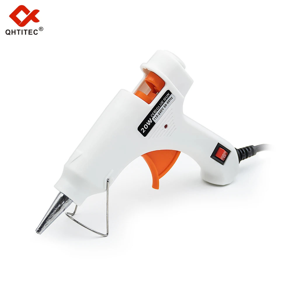 A white hot melt glue gun with an orange handle and glue sticks is shown on a white background.