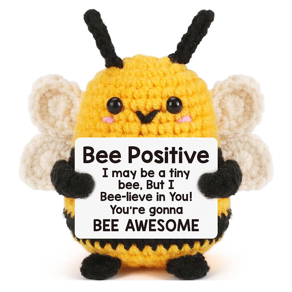 A yellow bee plush ornament with black antennae and fuzzy wings.