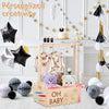Rustic wooden baby shower crate with a handle decorated for a personalized creativity theme.