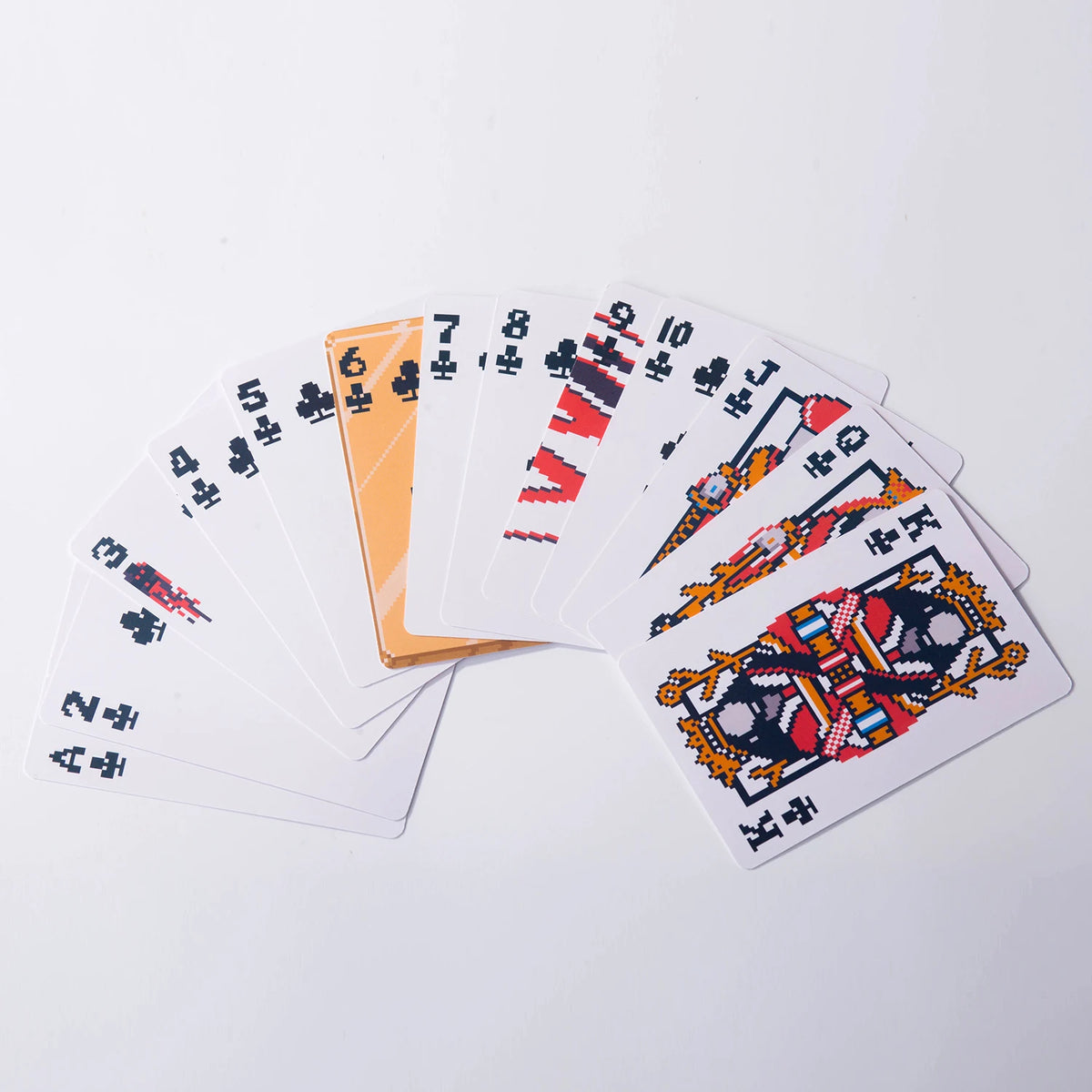 A fan of classic poker playing cards showing a spread of various numbered and face cards.