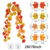 Artificial maple leaf garland in autumn colors, featuring red, orange, and yellow leaves on a vine.