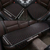 A set of three black quilted car seat covers for all-season protection shown in a vehicle interior.