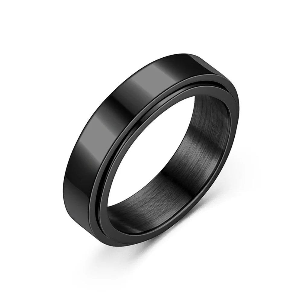 A black stainless steel anxiety spinner ring shown in a top-down view.