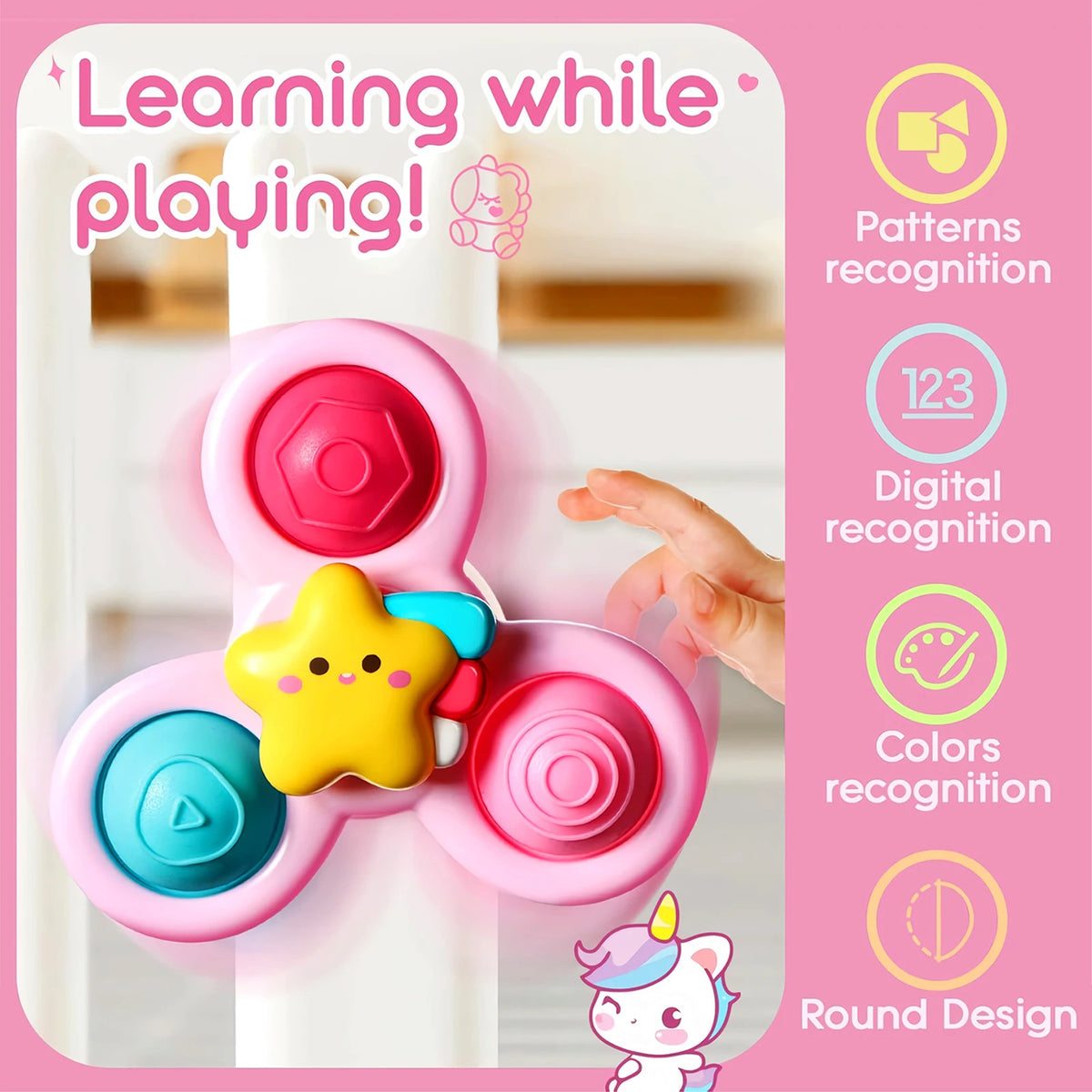 A pink suction cup spinner sensory toy with colorful parts is shown being played with by a hand.
