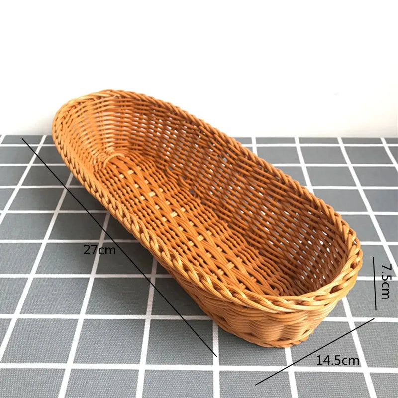 Handwoven wicker serving basket with dimensions 27cm long, 14.5cm wide, and 7.5cm high.