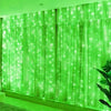 Green LED curtain string lights with fairy lights illuminating a window or backdrop.