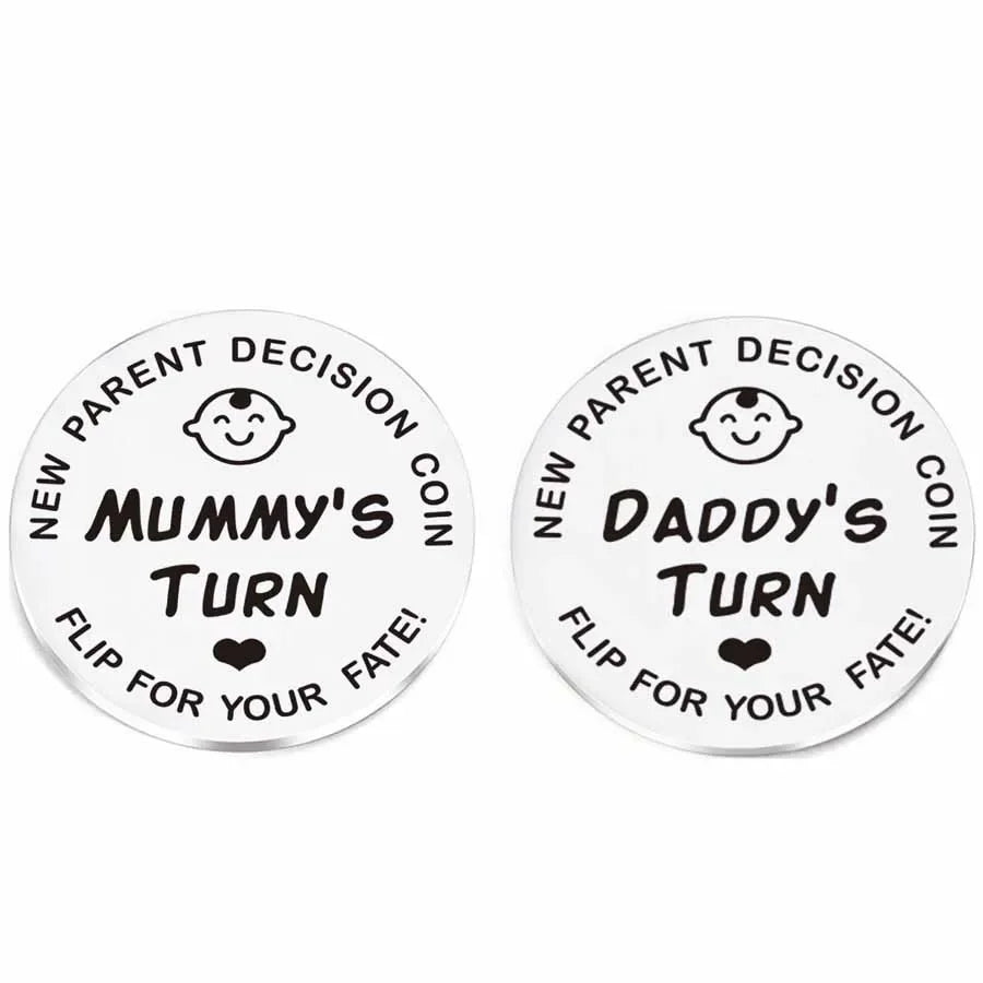 A pair of silver double-sided decision coins for new parents, labeled Mummy's Turn and Daddy's Turn.