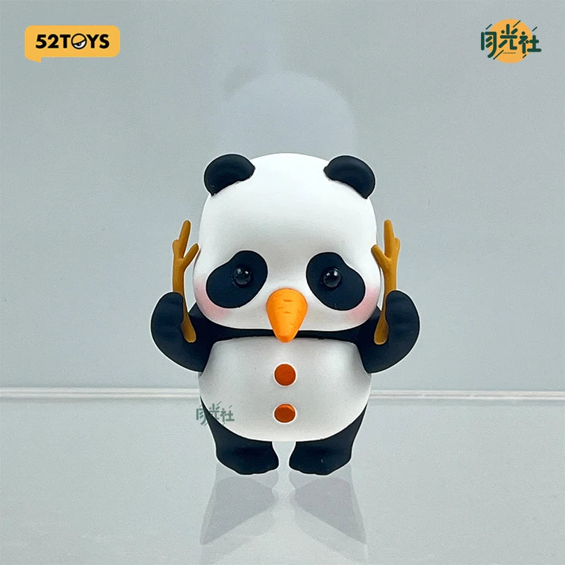 A white and black panda figure blind box with orange nose and yellow paws.
