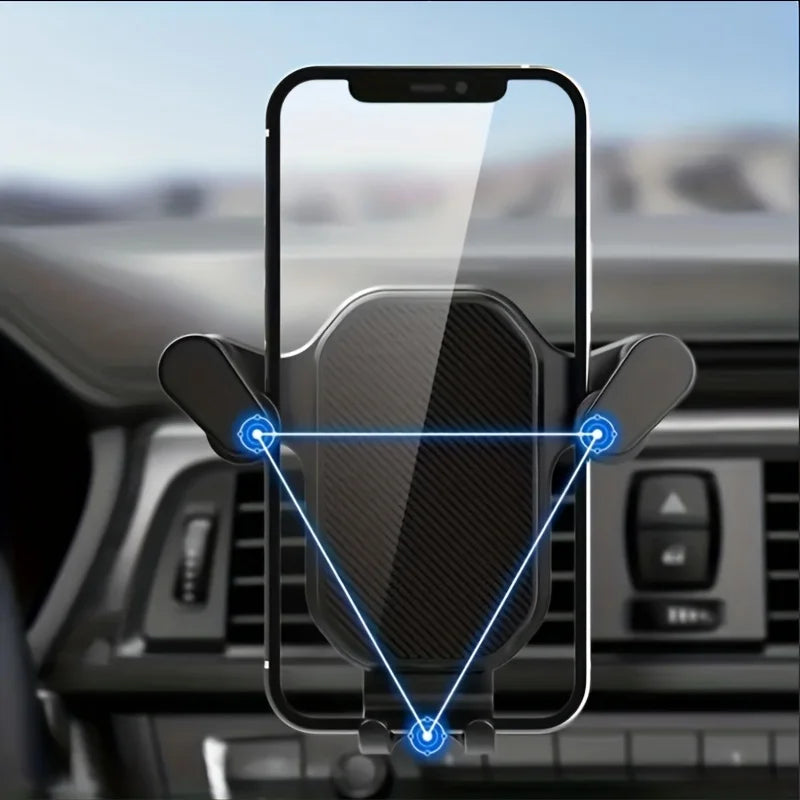 A phone holder is mounted on a car air vent, showing a smartphone being held in place.