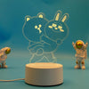 A glowing outline of two cute animal characters, a bear and a rabbit, displayed on a white base.