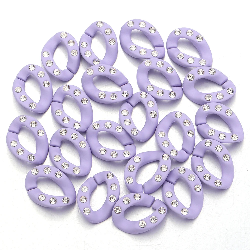 A set of twenty lavender acrylic jewelry connector clasps with crystal accents.