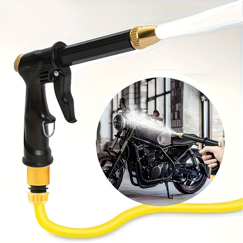 A black high-pressure car wash gun with a yellow hose and gold nozzle is shown next to a motorcycle.