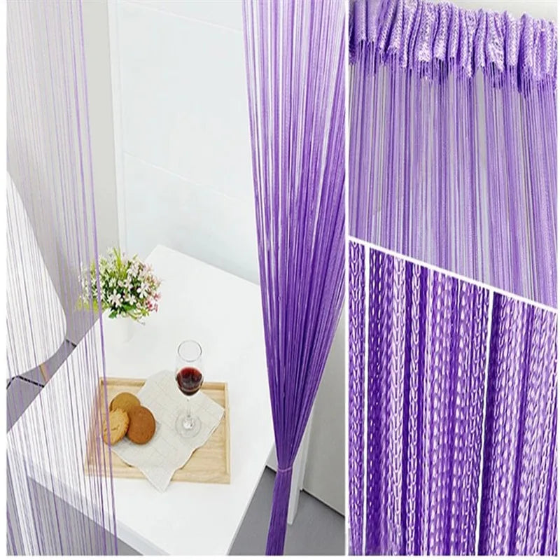 Purple beaded thread curtain hanging in a doorway, showing vertical strands of purple threads.